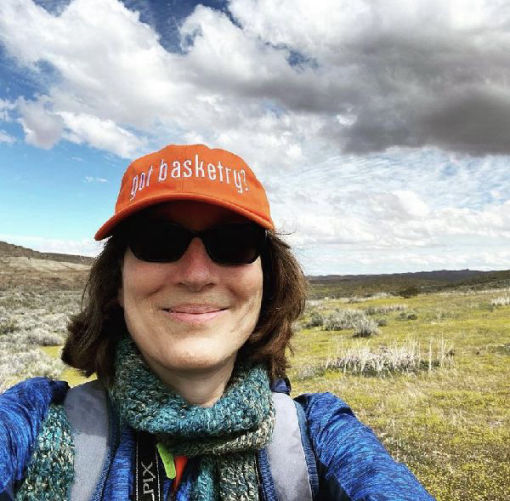 Monique Stevens on a hike wearing a 'got basketry?' cap