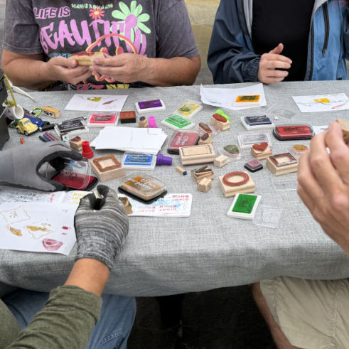 Rubber stamps atop a table for postcard contest