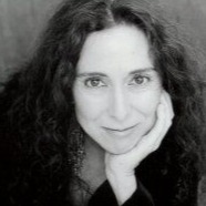 Alicia in a black and white headshot